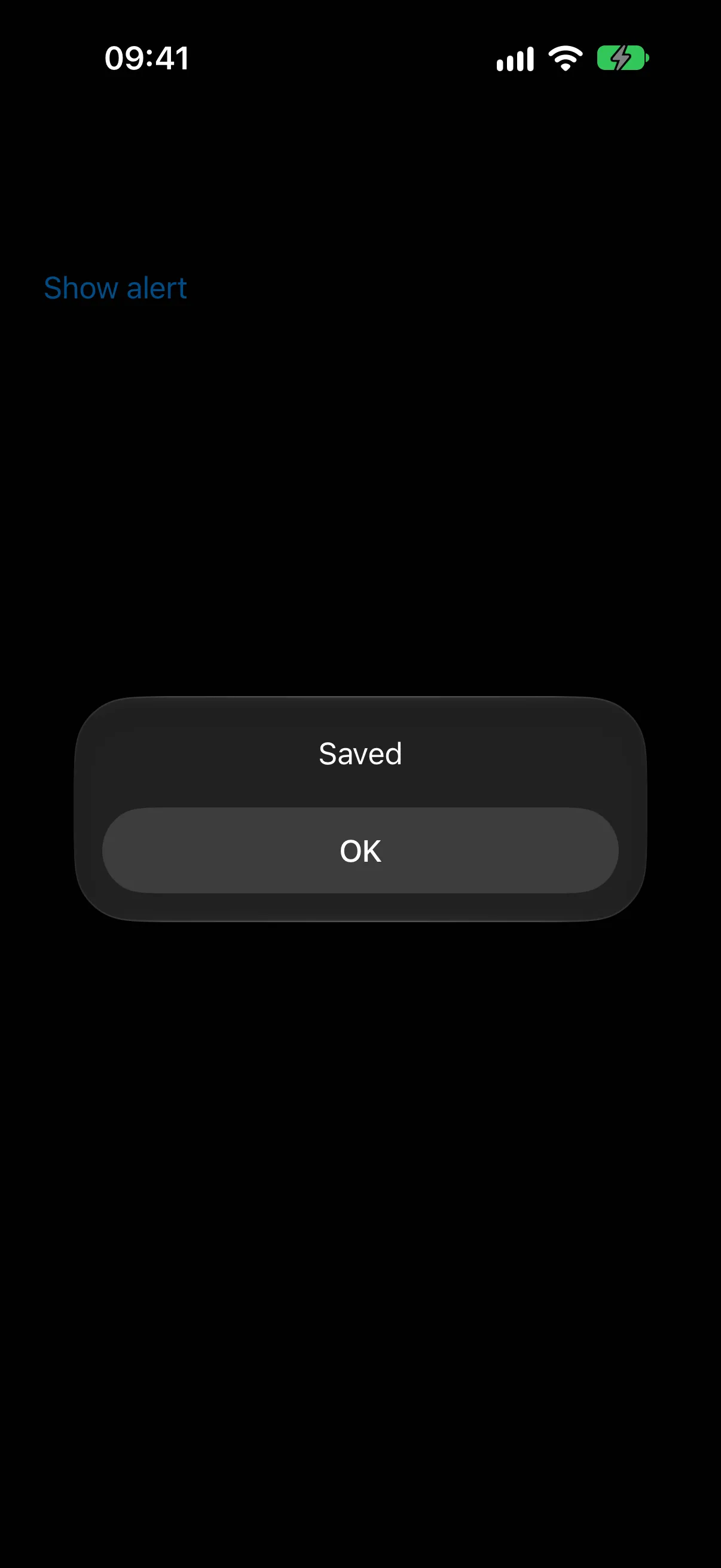 Alert titled Saved with a single OK button, above the Show alert trigger