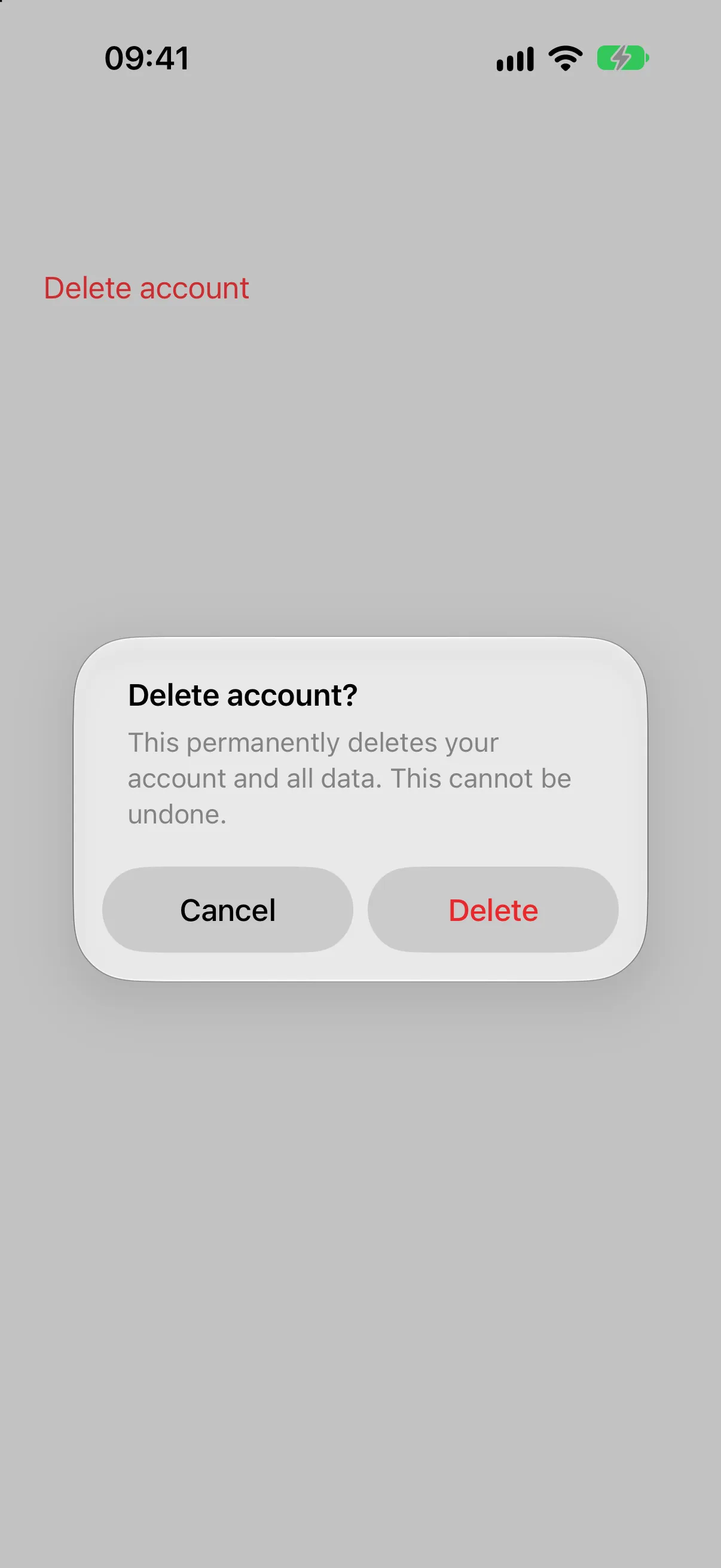 Alert titled Delete account? with a message, a Cancel button, and a red Delete button