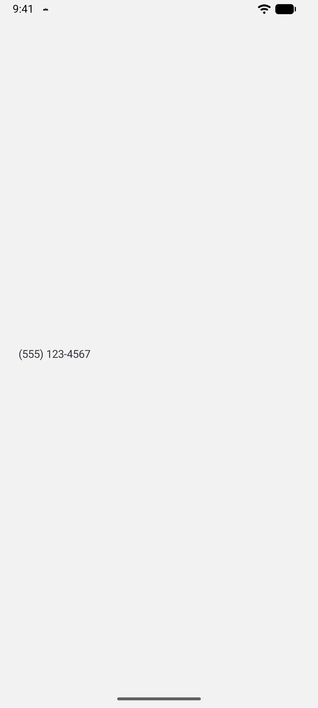A Material 3 text field containing a formatted phone number